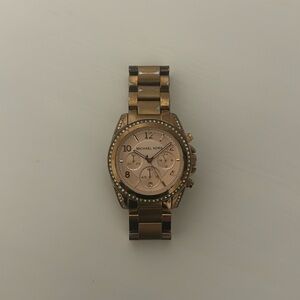 Michael Kors woman’s rose gold wrist watch
